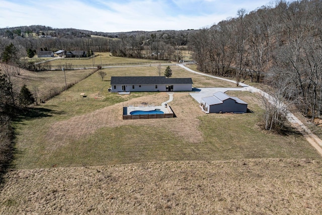 drone / aerial view with a rural view and a view of trees