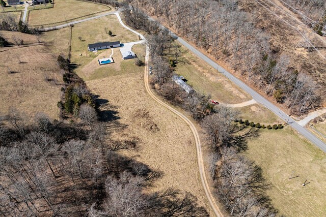 birds eye view of property with a rural view