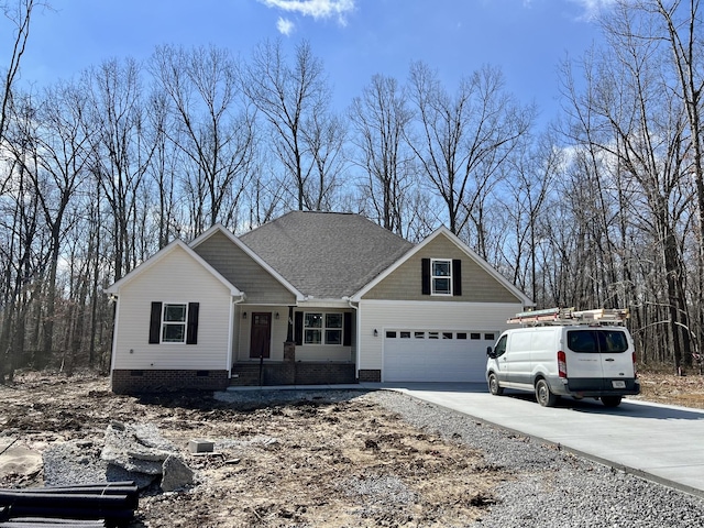 view of front of property with a garage, concrete driveway, a shingled roof, and crawl space