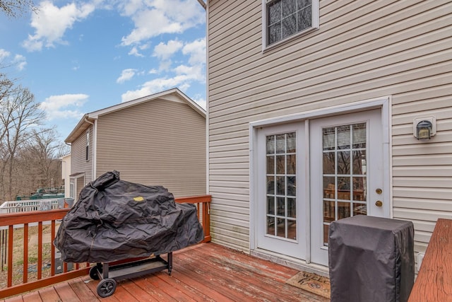 wooden terrace with area for grilling