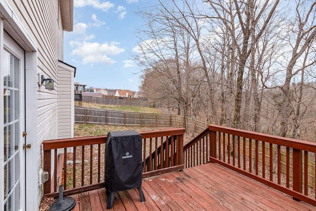 wooden terrace featuring fence