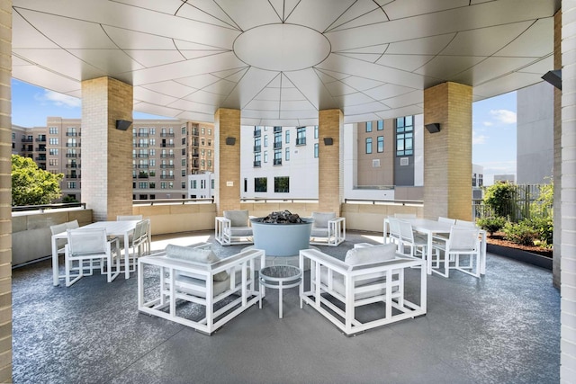 view of patio / terrace with outdoor dining area and a city view