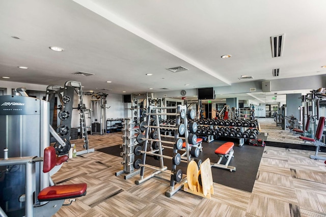 exercise room with carpet floors, recessed lighting, and visible vents