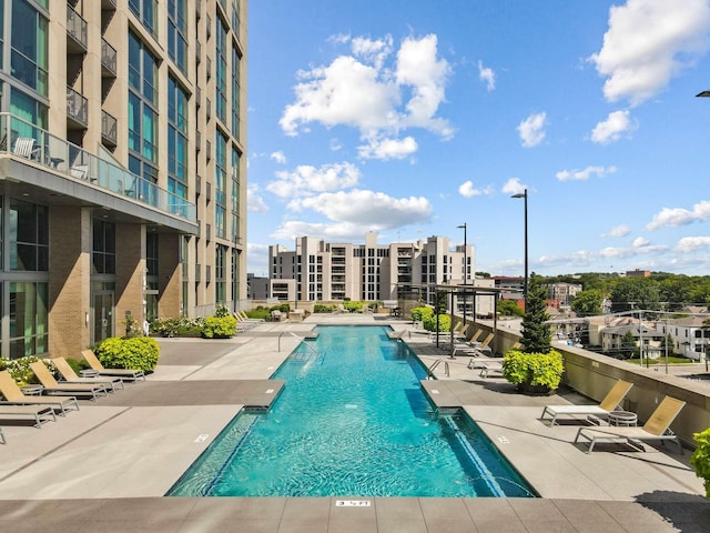 community pool with a patio area