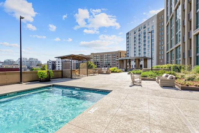 pool featuring a patio area and a city view