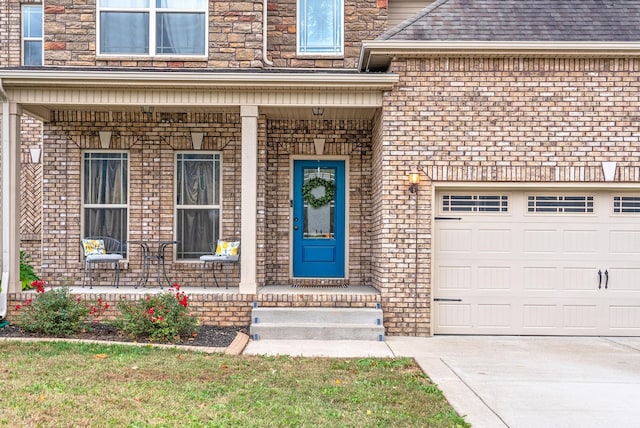 view of exterior entry featuring covered porch, roof with shingles, brick siding, and concrete driveway