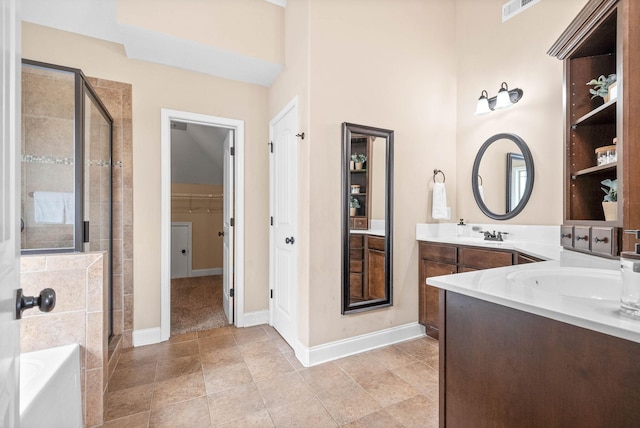 full bathroom featuring double vanity, visible vents, a shower stall, baseboards, and a bath