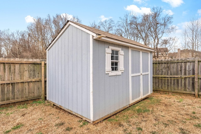 view of shed with a fenced backyard