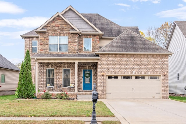 craftsman-style home featuring driveway, roof with shingles, an attached garage, a front lawn, and brick siding