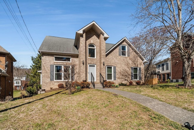6545 Chessington Dr, Nashville, TN 37221 - traditional-style home with a shingled roof, a front lawn, and brick siding