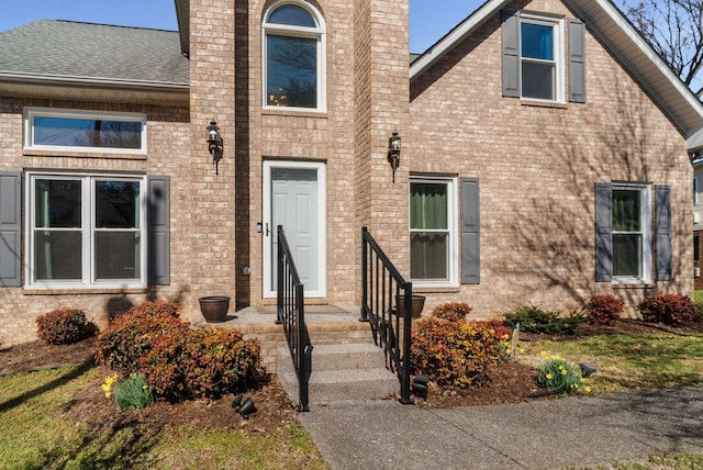 6545 Chessington Dr, Nashville, TN 37221 - property entrance with roof with shingles, a chimney, and brick siding