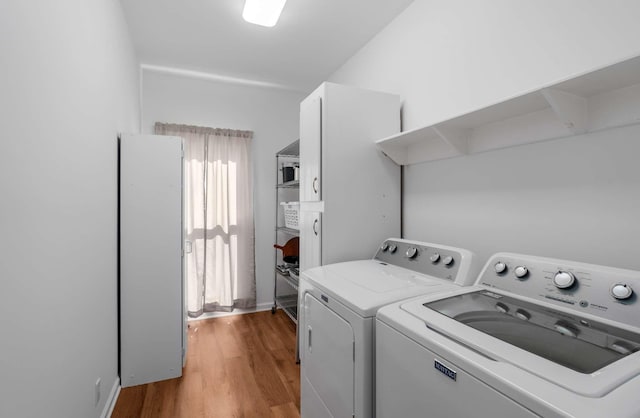 6545 Chessington Dr, Nashville, TN 37221 - clothes washing area featuring laundry area, light wood-style flooring, and washer and dryer