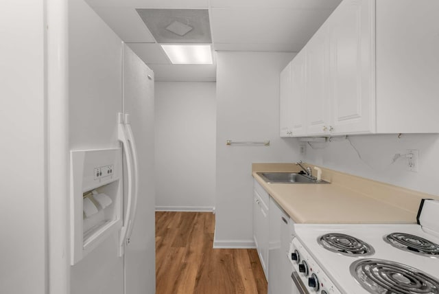 6545 Chessington Dr, Nashville, TN 37221 - kitchen with light wood-style flooring, white appliances, a sink, white cabinetry, and light countertops