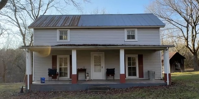 view of front of home with covered porch and metal roof