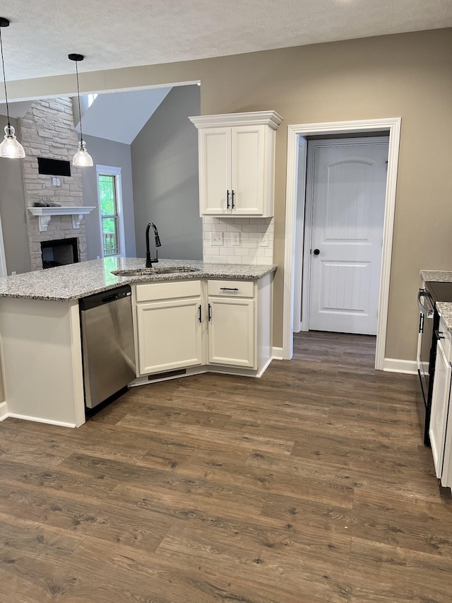 kitchen with dark wood-type flooring, a sink, white cabinets, light stone countertops, and dishwasher