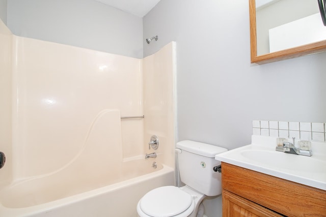 bathroom featuring  shower combination, vanity, and toilet