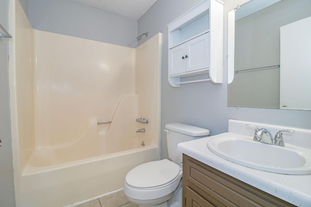 bathroom featuring toilet, vanity, a textured ceiling,  shower combination, and tile patterned flooring