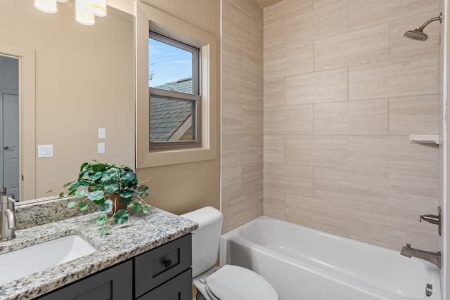 bathroom featuring vanity, toilet, and bathing tub / shower combination