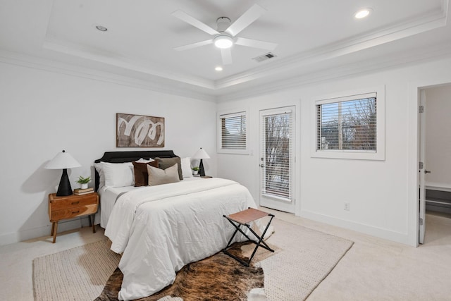 bedroom featuring light carpet, access to exterior, visible vents, and a tray ceiling