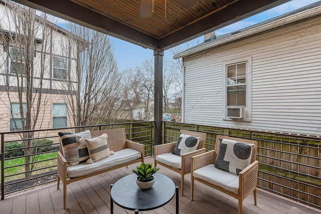 wooden deck with ceiling fan and an outdoor hangout area