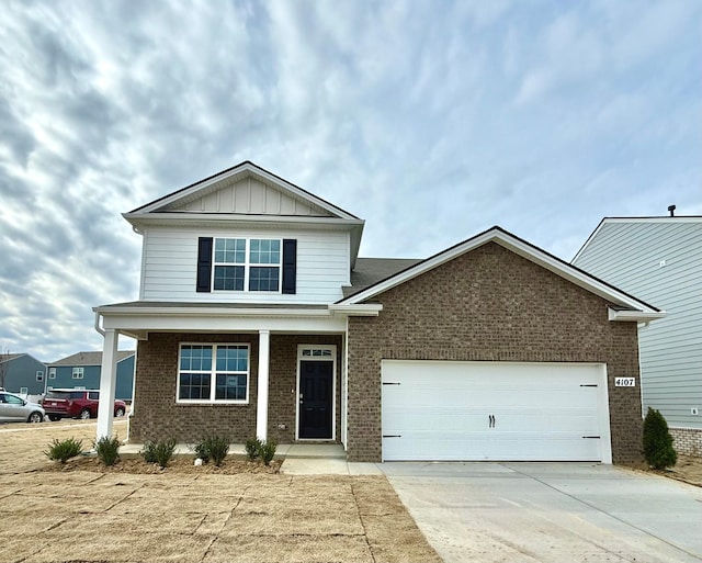 craftsman house with board and batten siding, brick siding, driveway, and an attached garage