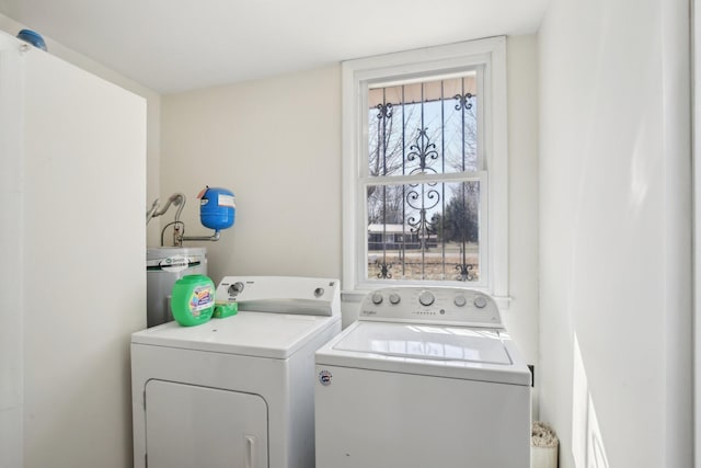 laundry area featuring laundry area, separate washer and dryer, and electric water heater