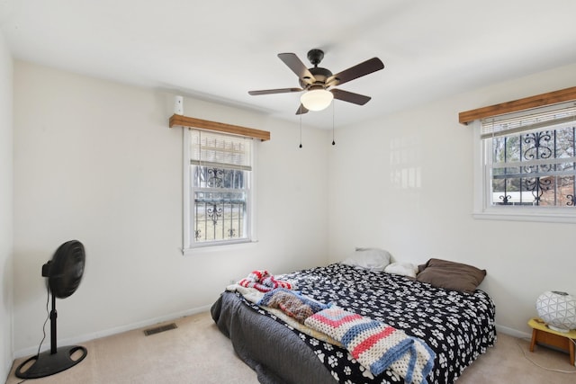 bedroom featuring carpet, visible vents, and baseboards