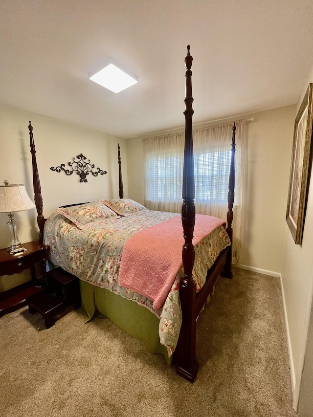 bedroom with carpet and baseboards