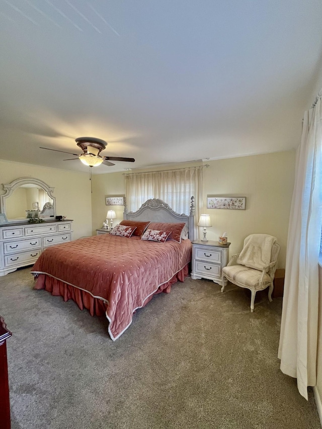 carpeted bedroom with a ceiling fan