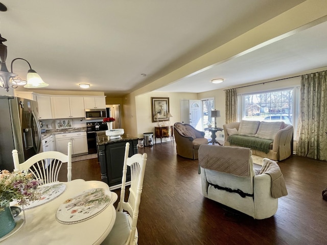 dining area with dark wood finished floors