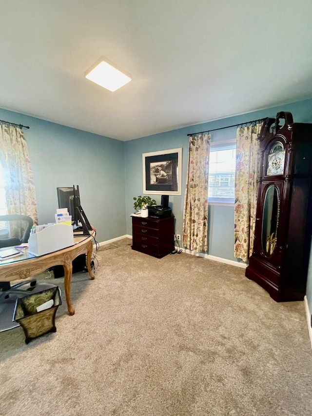 carpeted office featuring baseboards