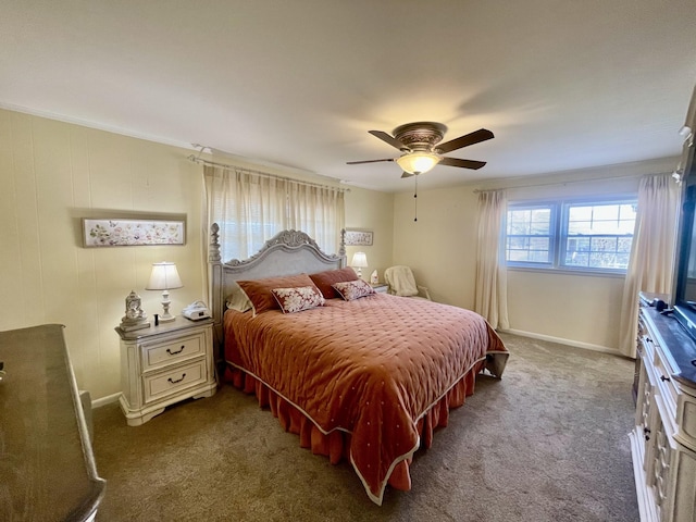 bedroom with ceiling fan, baseboards, and dark colored carpet