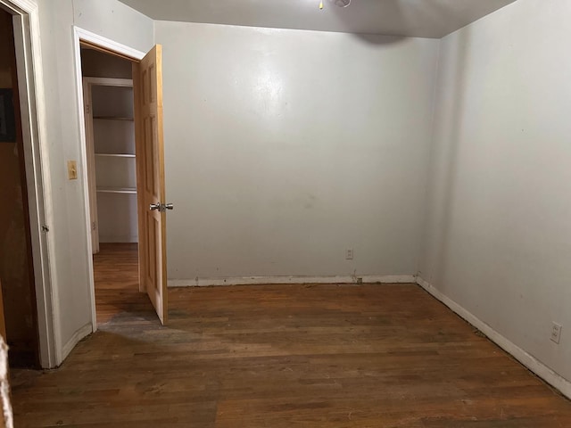 spare room featuring wood finished floors