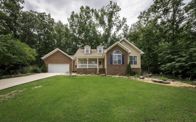 view of front of house featuring driveway, a garage, covered porch, a front lawn, and brick siding