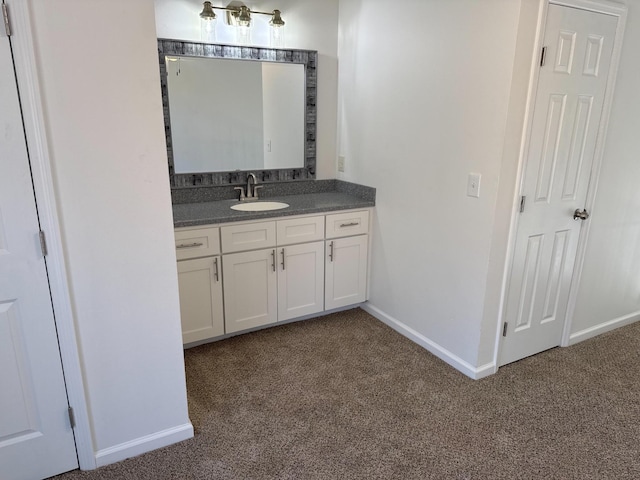 bathroom with vanity and baseboards