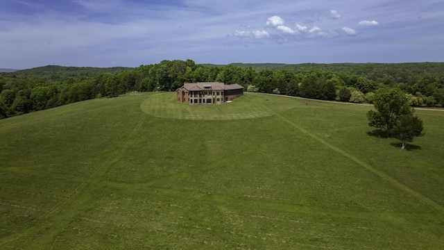 drone / aerial view with a view of trees