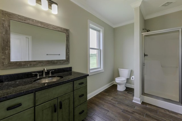 bathroom with toilet, wood finished floors, visible vents, a shower stall, and crown molding