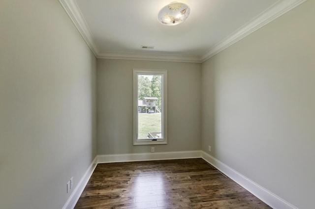 spare room with baseboards, crown molding, visible vents, and dark wood-style flooring