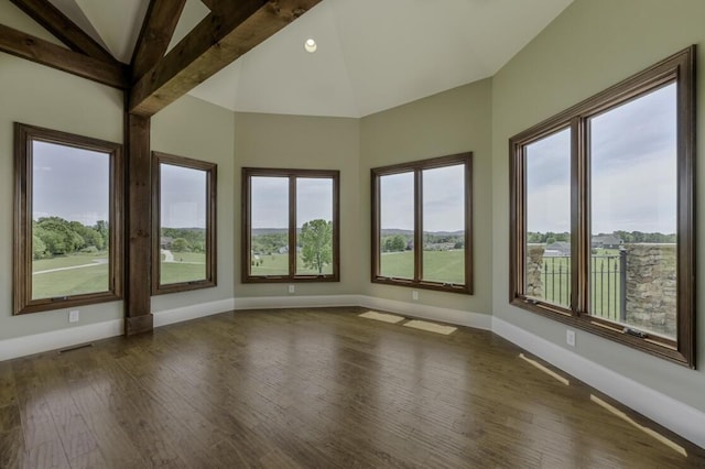 unfurnished sunroom featuring a healthy amount of sunlight, vaulted ceiling, and visible vents