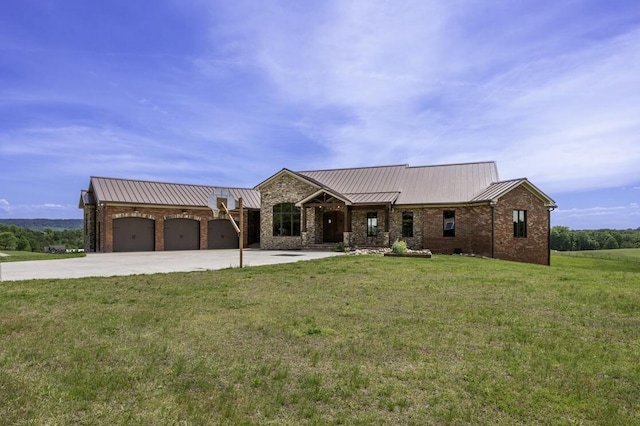 view of front of property with metal roof, an attached garage, brick siding, driveway, and a front lawn