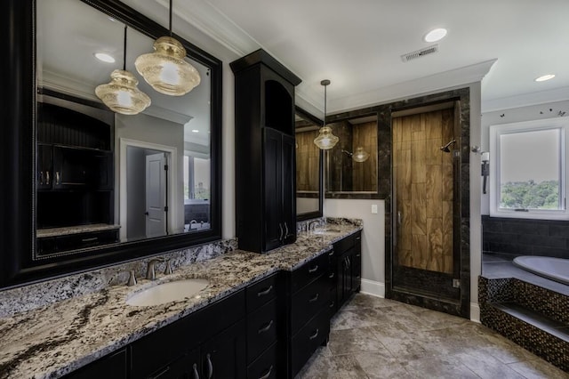 full bathroom with crown molding, visible vents, a sink, and a shower stall