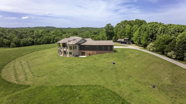 drone / aerial view with a view of trees