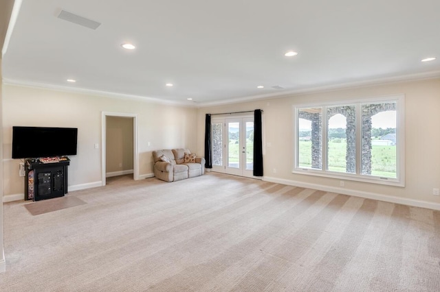 unfurnished room featuring recessed lighting, baseboards, crown molding, and light colored carpet