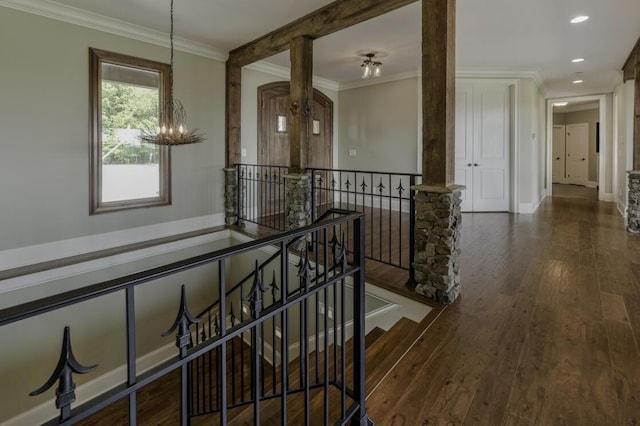 corridor featuring wood-type flooring, crown molding, an upstairs landing, a notable chandelier, and recessed lighting