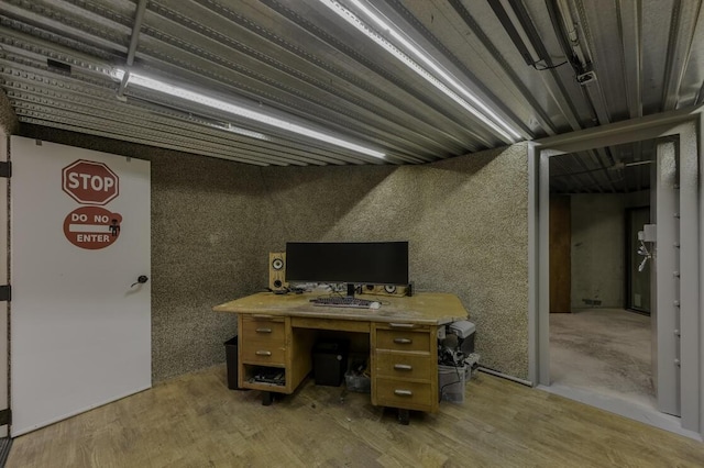 unfurnished office featuring light wood-type flooring