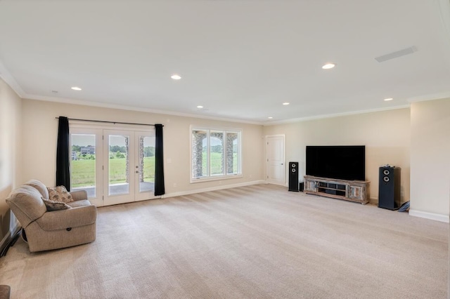 living room with baseboards, ornamental molding, and light colored carpet