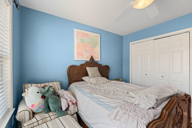 bedroom featuring ceiling fan and a closet