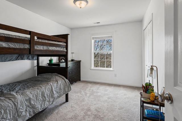 bedroom featuring carpet, visible vents, and baseboards