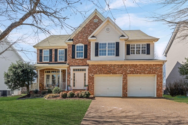 view of front of house featuring an attached garage, concrete driveway, brick siding, and a front yard