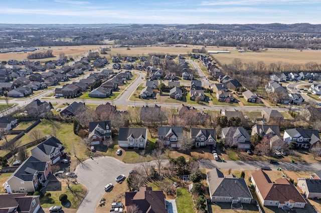 birds eye view of property with a residential view